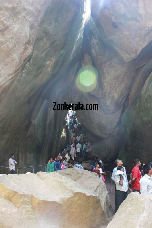 People view through the huge rocks of edakkal caves 111