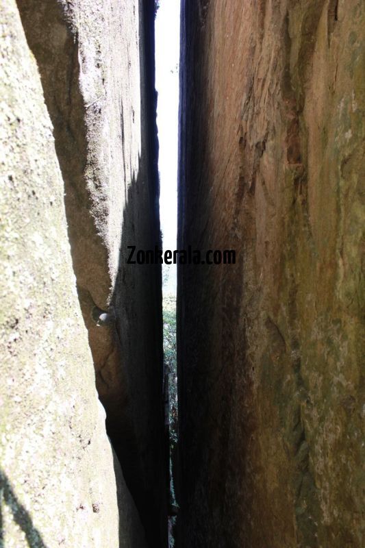 View through the two huge rocks of edakkal caves 737