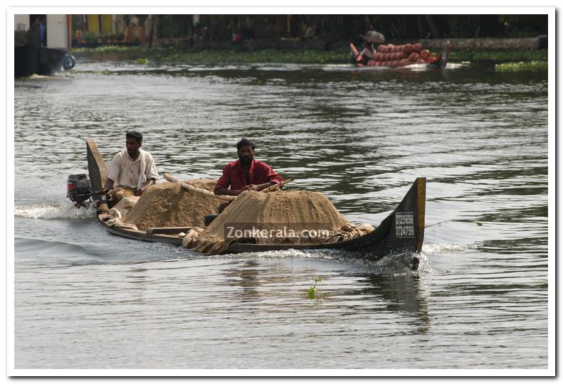 Men with sand in boats 1