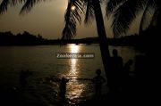 People taking bath in river in kerala