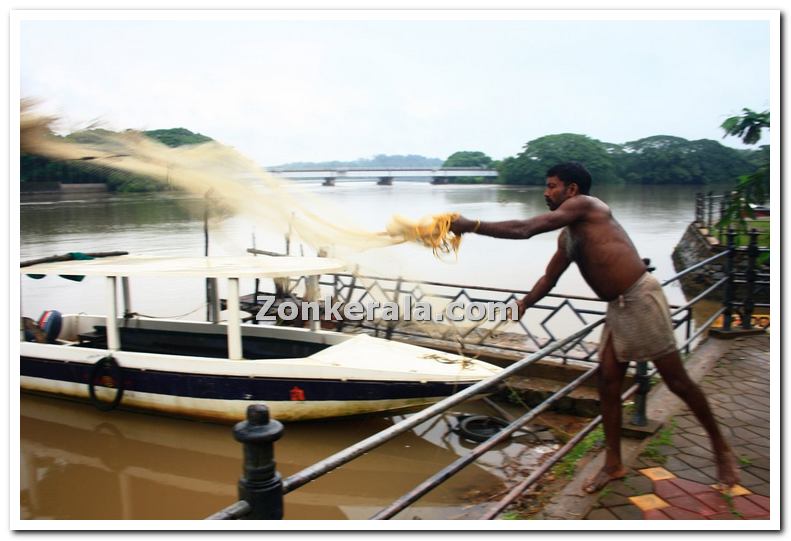 Fisherman throwing net