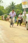 Mohanlal On Cycle In Movie Drishyam 235